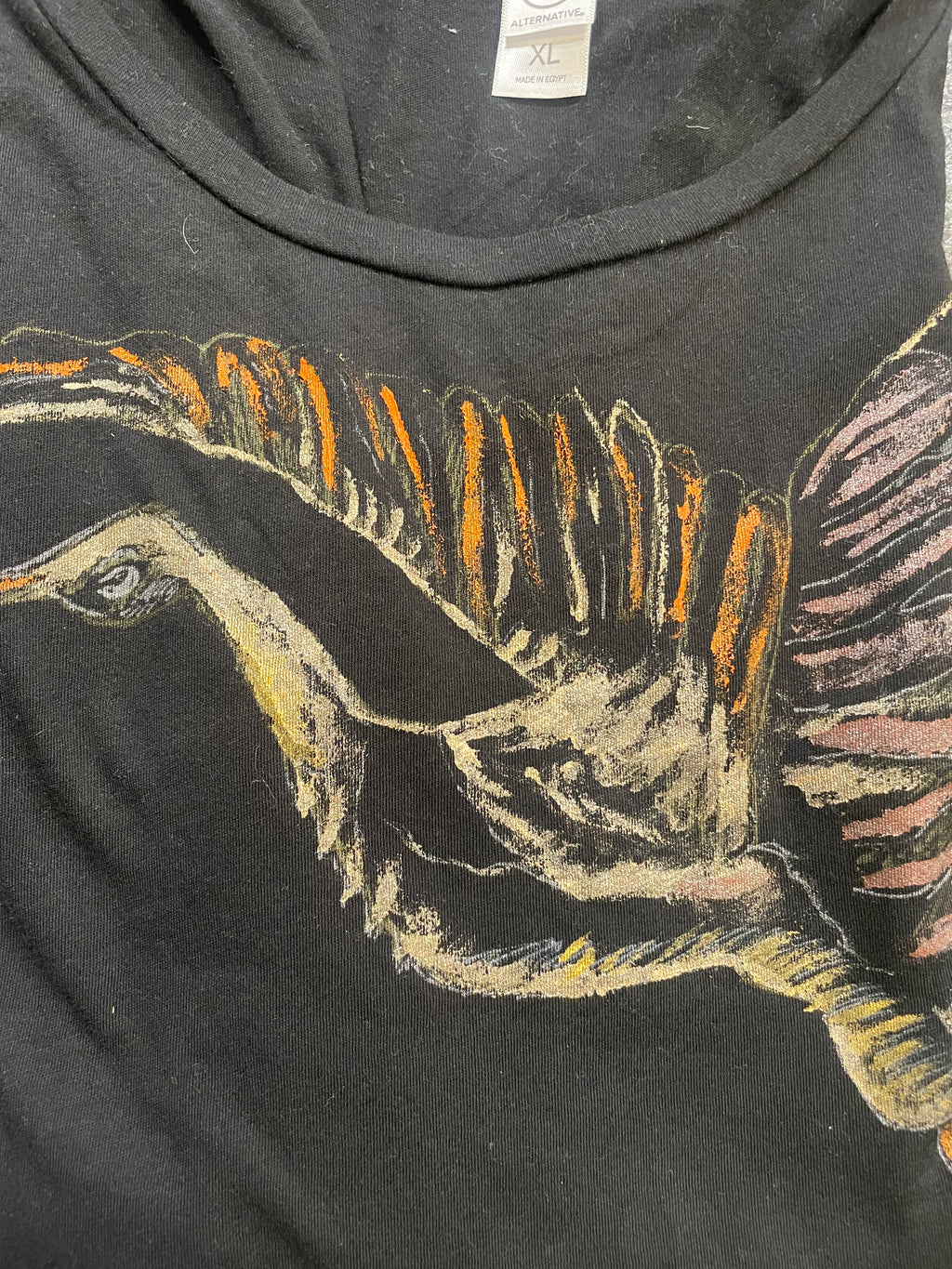 black XL t shirt that I painted the crane with gold, white and orange